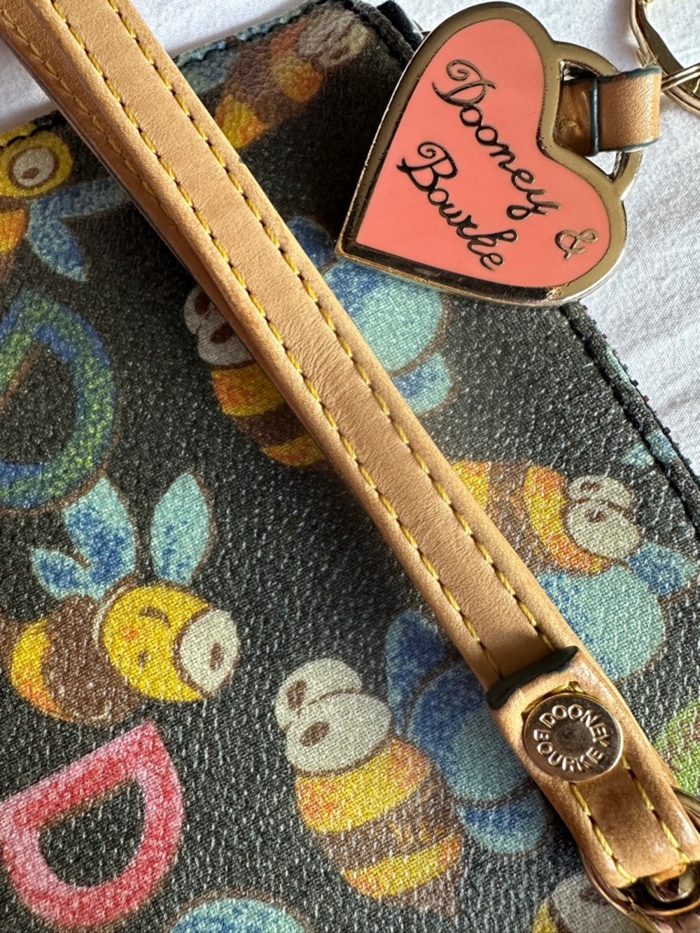 Dooney & Bourke Multicolor Bee Print Wristlet with Pink Heart Charm